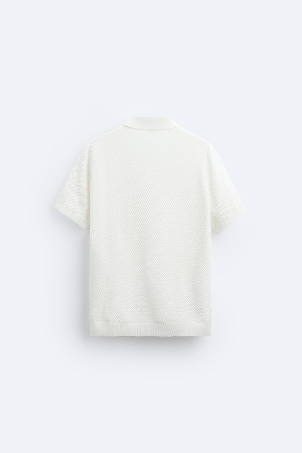 Polo de punto clásico en blanco