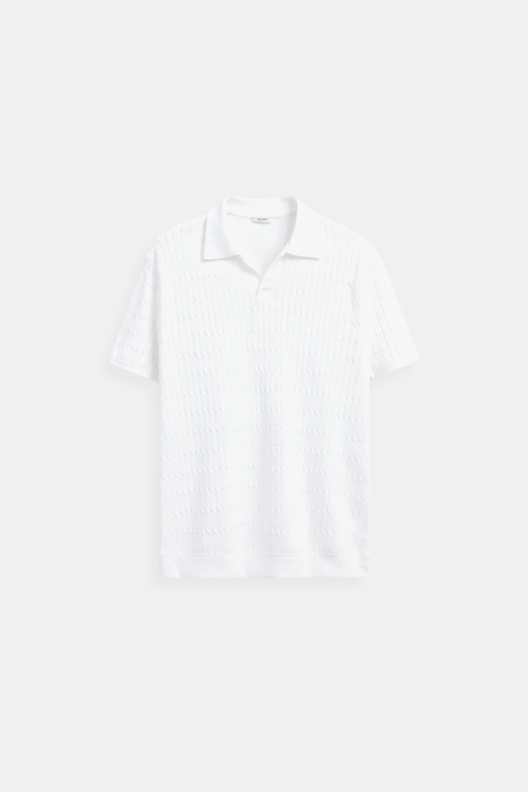Camisa polo de punto blanca con patrón texturizado