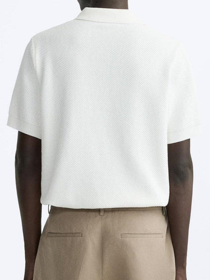 Polo de punto clásico en blanco